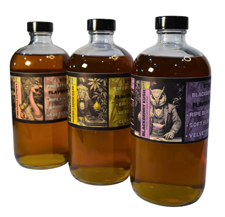 Three bottles of alcohol with decorative labels on a white background